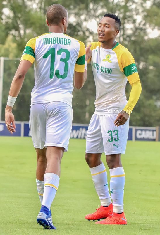 Tiyani Mabunda celebrating with a Mamelodi Sundowns teammate
