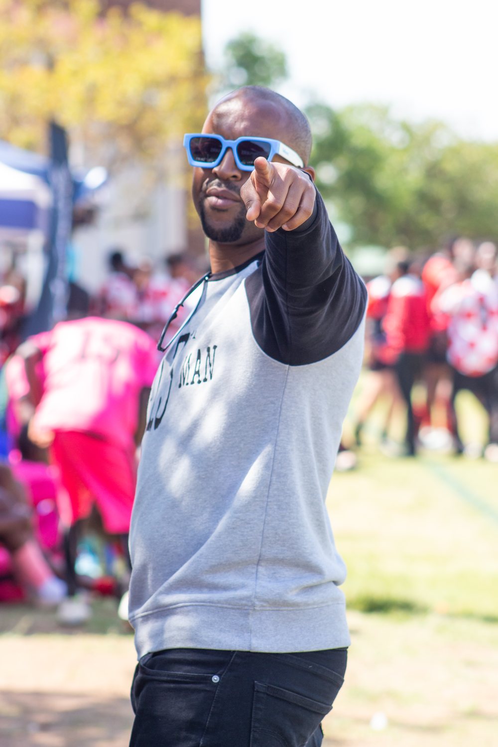 The 13th Man pointing to the camera on match day
