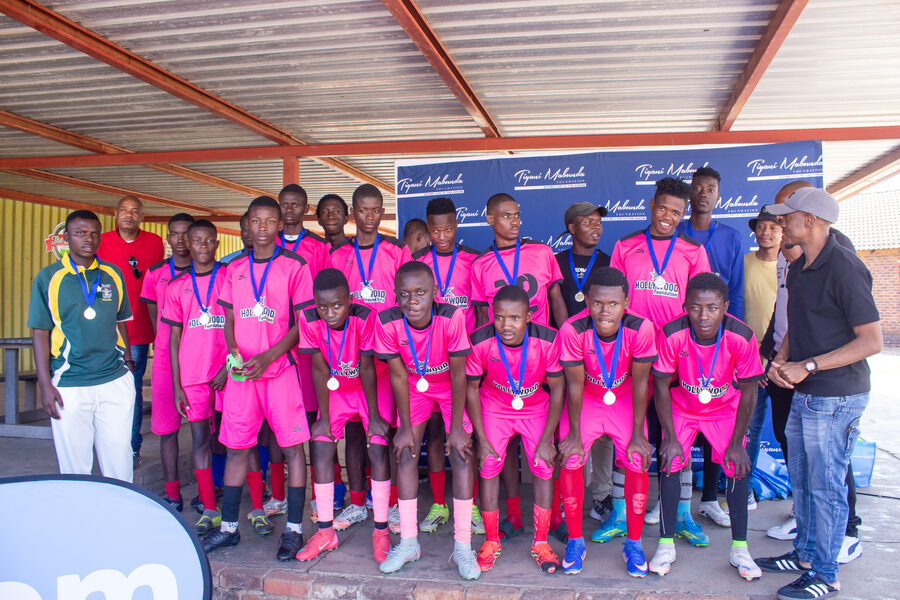 A team poses with their medals