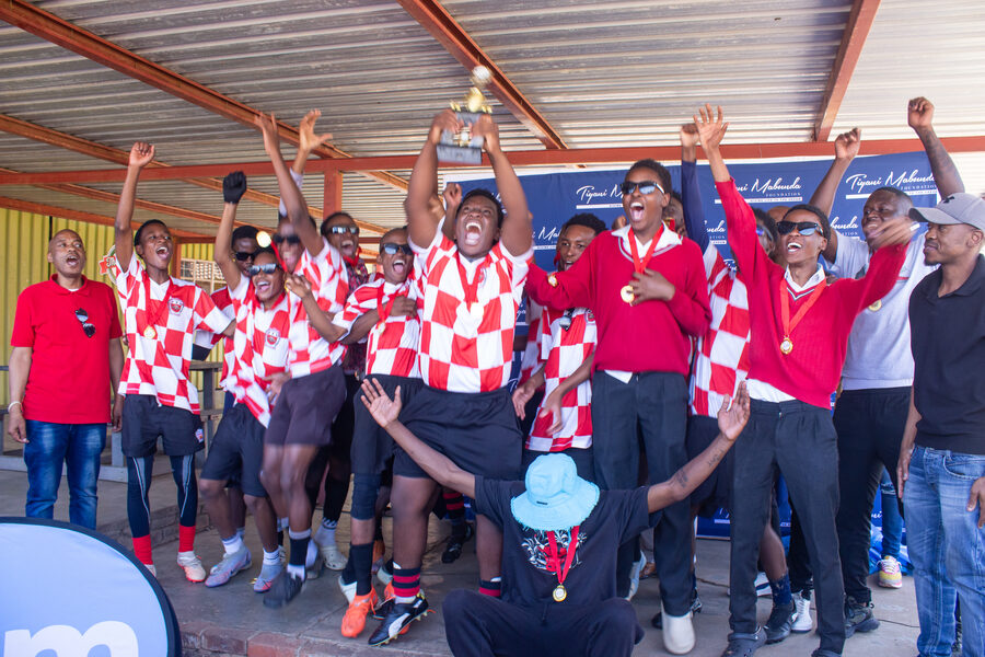 The winning team is presented with their trophy